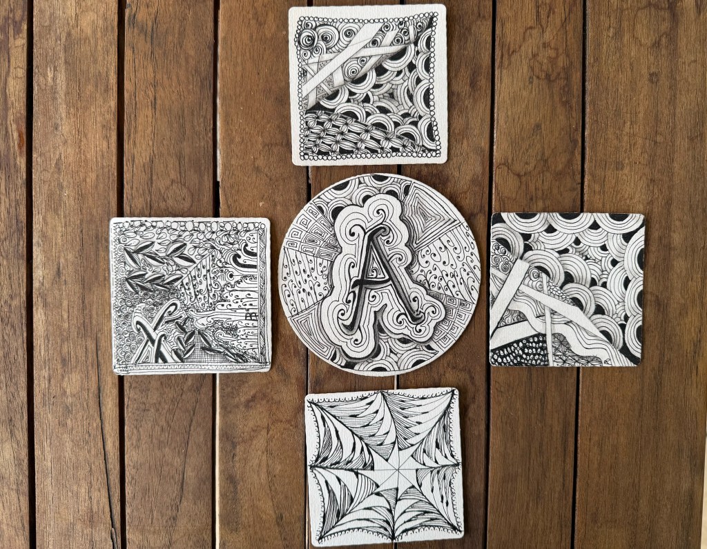 Grouping of zentangle art pieces created by online workshop participants