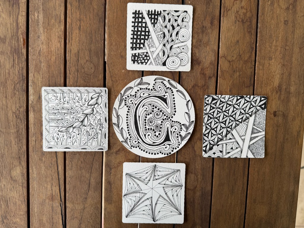 Grouping of zentangle art pieces created by online workshop participants
