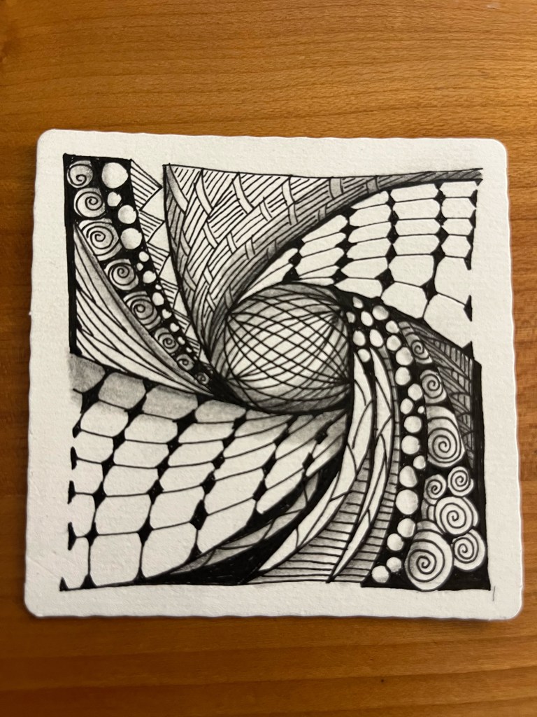 zentangle artwork that is black and white with a spiral pattern