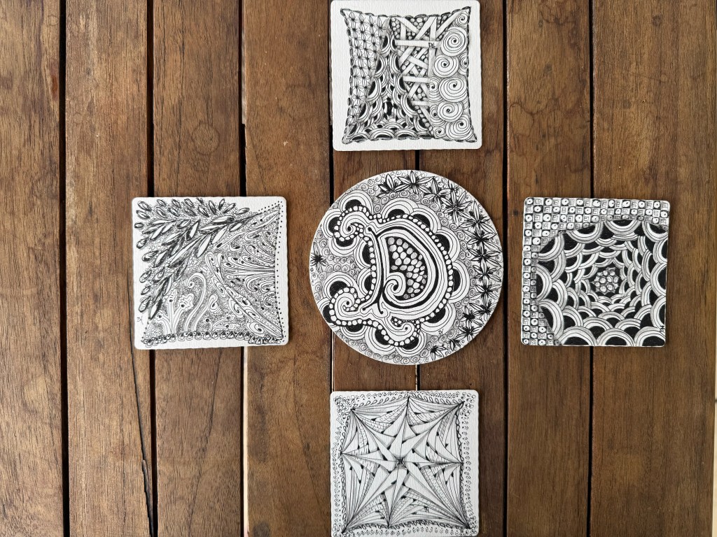 Grouping of zentangle art pieces created by online workshop participants