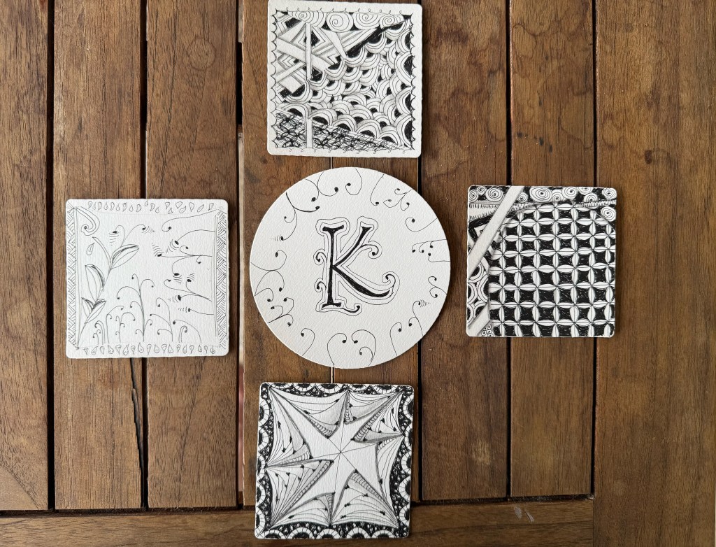 Grouping of zentangle art pieces created by online workshop participants