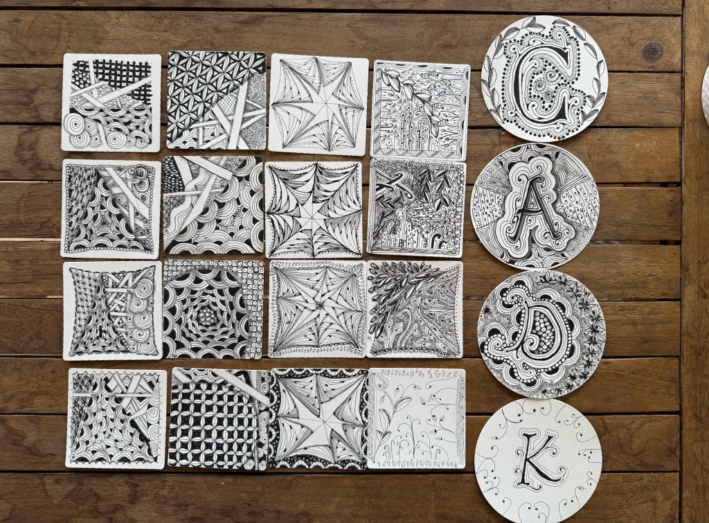 Grouping of zentangle art pieces created by online workshop